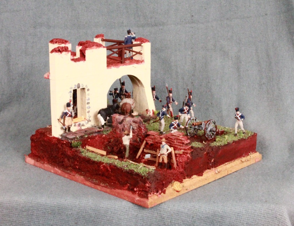 Diorama 12: parapeto junto a un edificio con cañón de campaña.